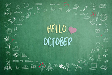 Hello October greeting on green school teacher's chalkboard with creative student's doodle of learning education graphic freehand illustration icon for back to school month concept