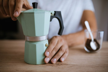 Fototapeta na wymiar Preparing Coffee In A Moka Pot