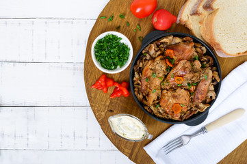Tender rabbit meat with forest mushrooms. A dietary dish. Top view.
