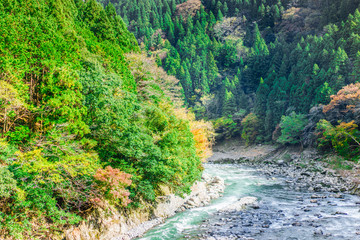 Beautiful mountain landscape and Hozu River seen from Sagano Scenic Railway or romantic train in Arashiyama, Japan.  Landscape and nature concepts.
