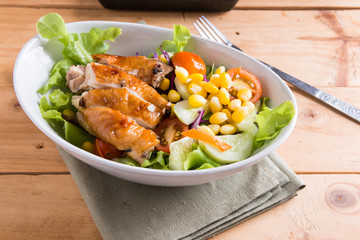Grilled chicken fillet with colorful salad