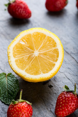 Naklejka na ściany i meble Lemon and strawberries, source of vitamin C