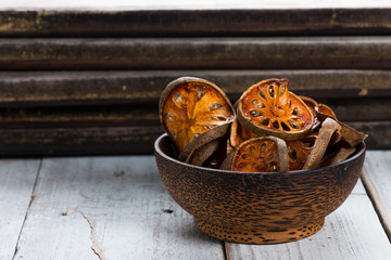 Dry Bael fruit - Slices of dry Bael fruit on the wooden table