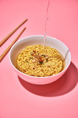 Cooking instant noodles, boiling water.