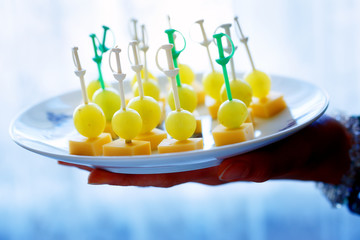 Canapes with grapes and chees. Party snack refreshment.