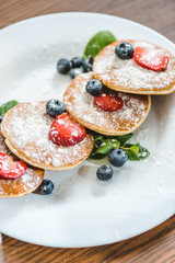 pancakes with berries and mint