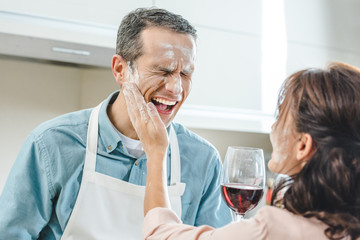 couple in flour with wine