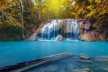 Waterfall with tree in autumn forest, Kanchanaburi, Thailand
