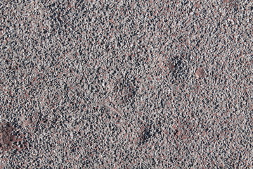 Granite rock closeup background, stone texture, cracked surface