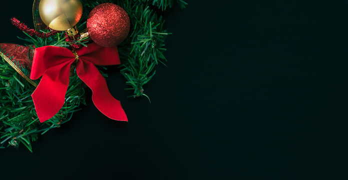 Decorated Christmas Wreath On A Black Surface