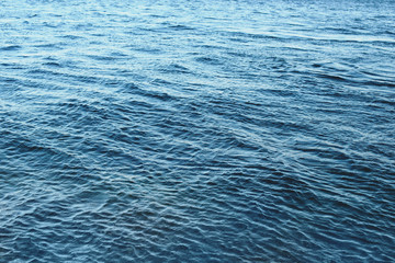 Blue ripples water in sea ocean. Surface of blue water in nature ocean. Textured background.