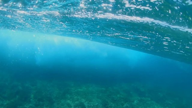 POV underwater ocean waves rolling into reef in French Polynesia Tahiti