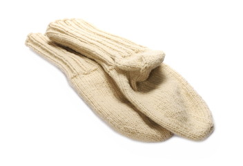 Traditional knitted woolen socks on white background