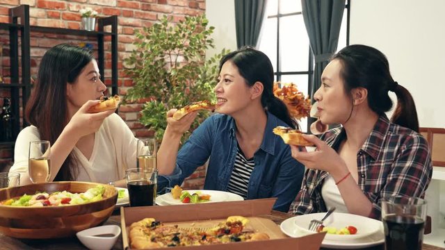 people enjoys pizza together at home