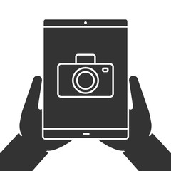Hands holding tablet computer glyph icon