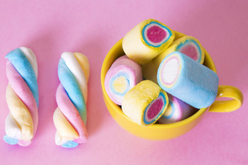 colorful marshmallows with pink background