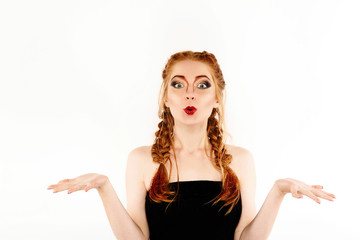 Fototapeta premium Pretty girl with red hair looks like a lion posing in the studio