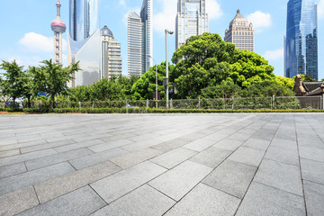 Fototapeta na wymiar Empty city square road and modern commercial buildings scenery in Shanghai
