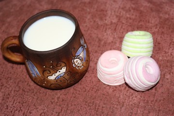 clay mug of milk with marshmallows