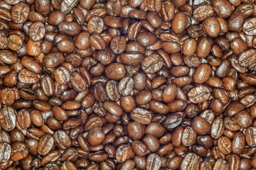 Roasted brown coffee beans texture background for food and drink concept design.