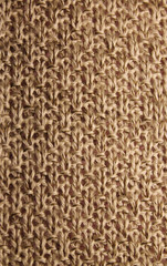 knitted beige texture closeup, background