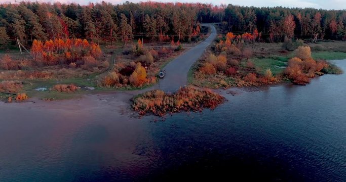Volga river in autumn at sunrise aerial view quadcopter over forest 4k. Landscape panorama. Beautiful nature. Horizon in the background of fields of meadows and sky.