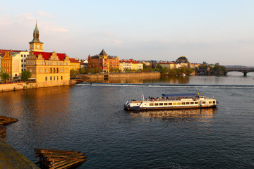 Naklejka premium Tourist boat floating on the Vltava river.