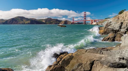 Papier Peint photo Plage de Baker, San Francisco Panoramic view of famous Golden Gate Bridge seen from scenic Baker Beach in sunny day with blue sky and clouds in summer, San Francisco, California, USA