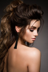 Naklejka premium Beautiful woman with professional make up and hairstyle