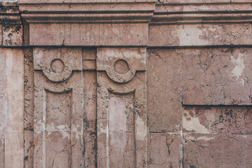 close-up shot of cracked wall with ancient decor elements for background