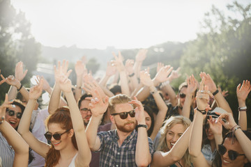 Group of people dancing at outdoor party
