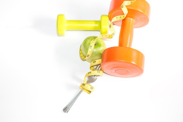 Healthy eating as Apple with Measuring tape wrapped around fork,Workout and fitness dieting ,fitness and weight loss concept on white background