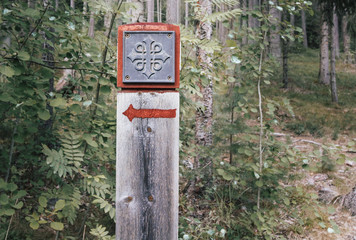 Red attraction sign in Norwegian forest