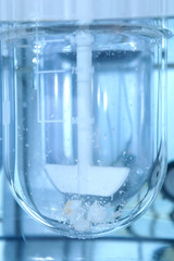 Autonomous solubility tester. Imitation dissolution of the tablet in the human stomach. Scientific research of pharmaceutical laboratory. Laboratory research in pharmacy.