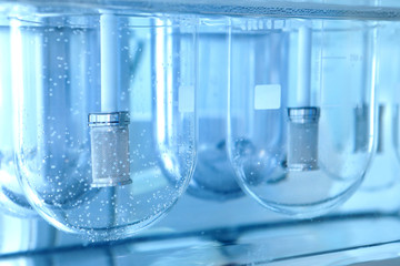 Autonomous solubility tester. Imitation dissolution of the tablet in the human stomach. Scientific research of pharmaceutical laboratory. Laboratory research in pharmacy.