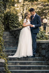 Fototapeta premium happy couple standing near modern city center