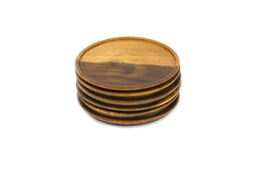 stack of old round wooden coasters on white background. vintage style concept.