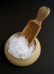 Pink salt in wooden bowl.