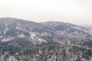 Autumn and winter landscape, the mountain and the river freezes
