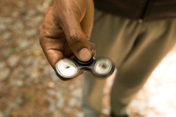 Man holding a fidget spinner