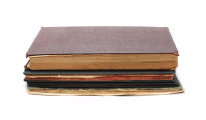 Stack of old antique big books isolated on white background