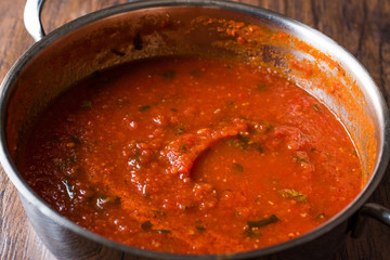 Tomato Sauce with Herbs in Metal Pot