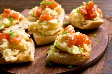 Healthy breakfast with bread toast, scrambled eggs, tomato