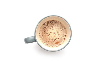 White coffee with milk in a mug view from top isolated over white background.