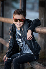 Adorable trendy kid in leather