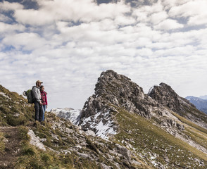 Naklejka na ściany i meble Germany, Bavaria, Oberstdorf, two hikers in alpine scenery