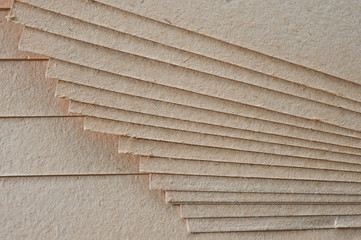 The texture of coarse paper, a bundle of cardboard