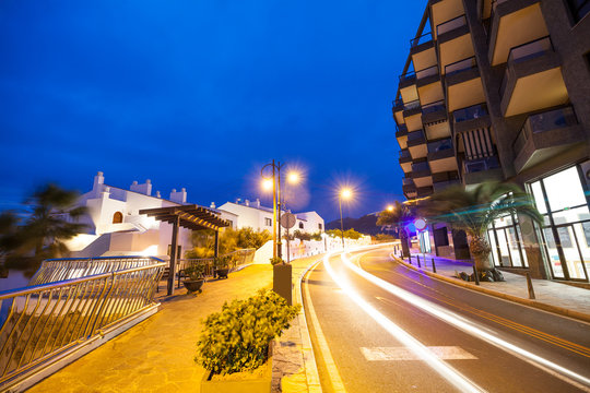 Night scene with a lamp illuminating the street of Puerto de Santiago, in Tenerife town, Spain