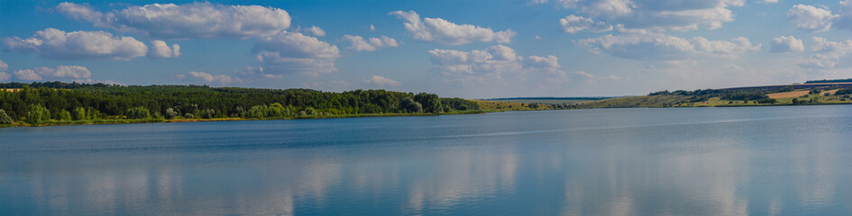 Lake, sky, clouds, panoramic landscape, summer.