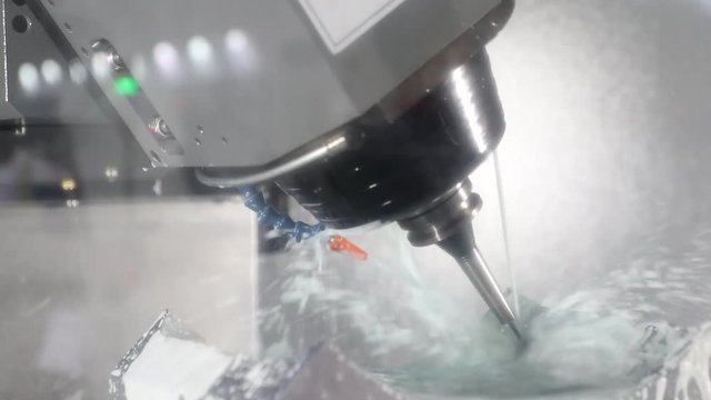 CNC machining Center machine a tooling with coolant spray